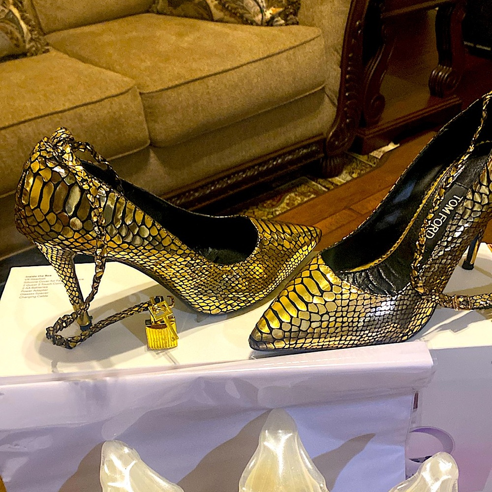 Fabulous lock and key Tom Ford heels.The heels are gold metallic .